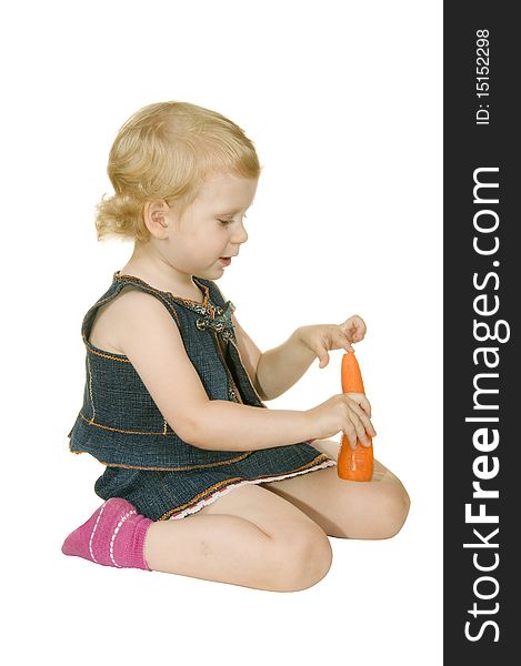 Small girl with carrot on white background