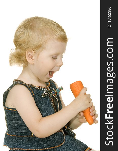 Small girl with carrot on white background