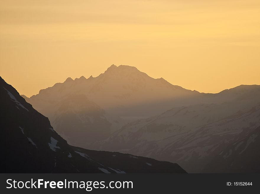 Sunset In Mountains