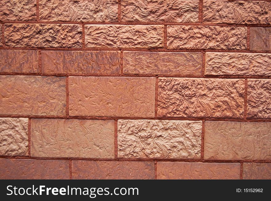 A detailed view of an old red brick wall