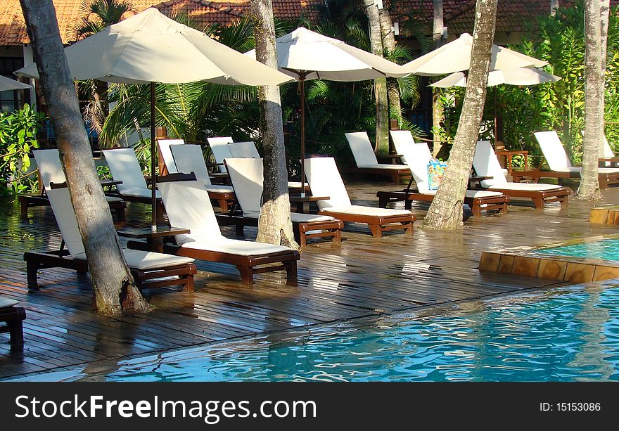 Image of Pool bench near swimming pool