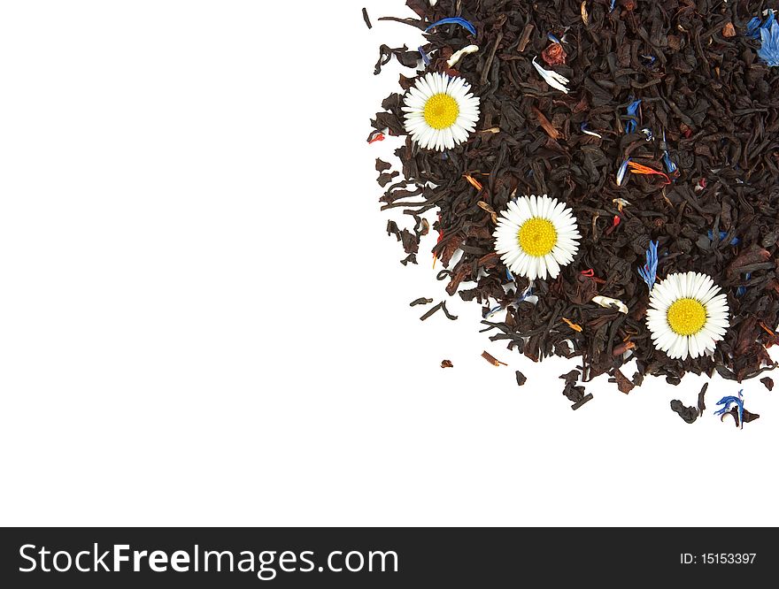 Flowers on the dry tea leaves background