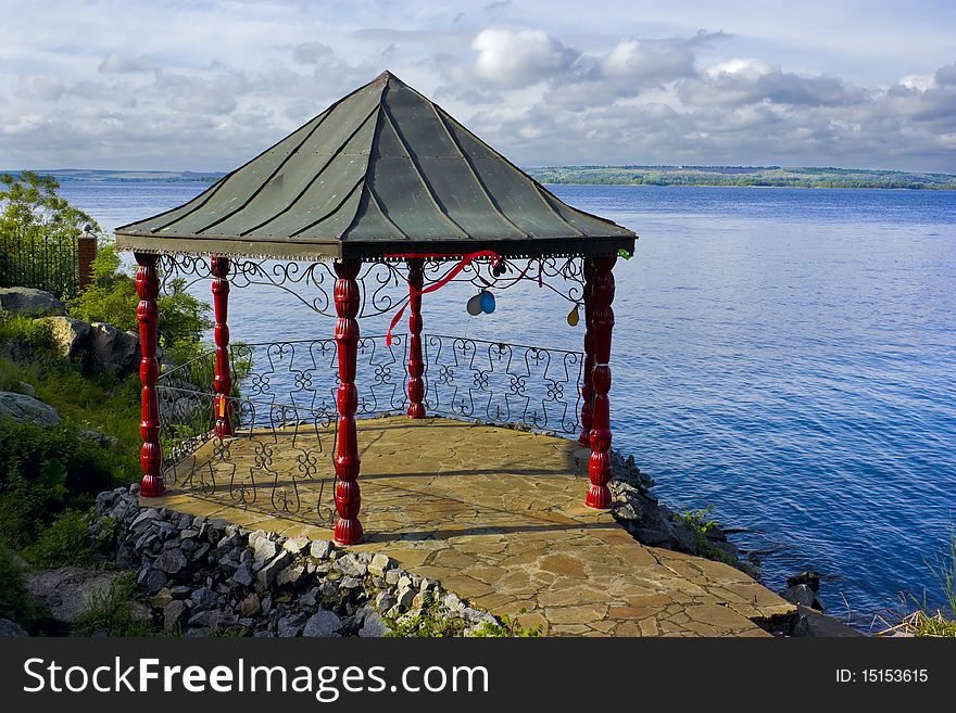 This is a beautiful landscape with a gazebo, in which was a celebration.