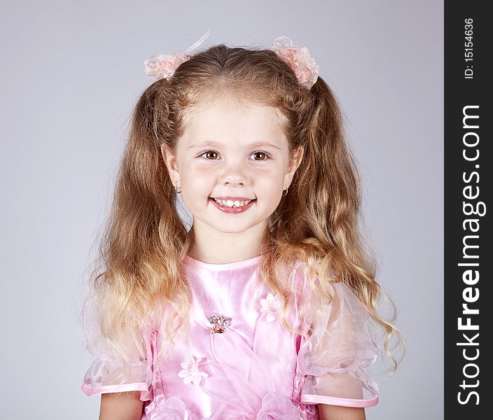 Beautiful young smiling girl. Studio shot.