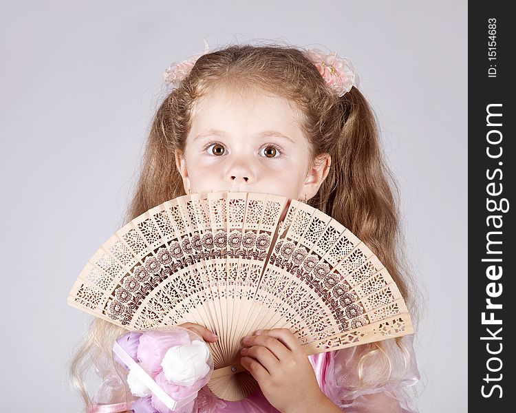 Portrait Of Beautiful Young Girl With Fan