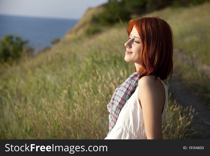 Girl at hill in sunrise.