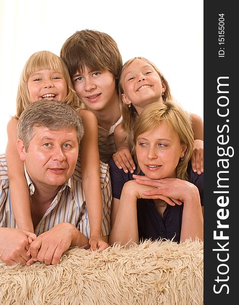 Portrait of a happy family of five on a light background