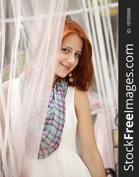 Portrait of beautiful red-haired girl at outdoor. Portrait of beautiful red-haired girl at outdoor.