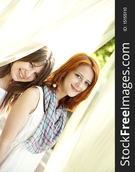 Portrait of two beautiful girls at outdoor.