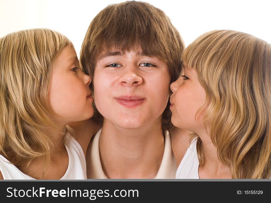 Teenager with her sisters on a white background. Teenager with her sisters on a white background