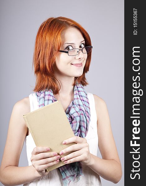 Red-haired Girl Keep Book In Hand.