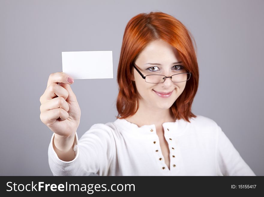 Portrait of an young woman with blank white card