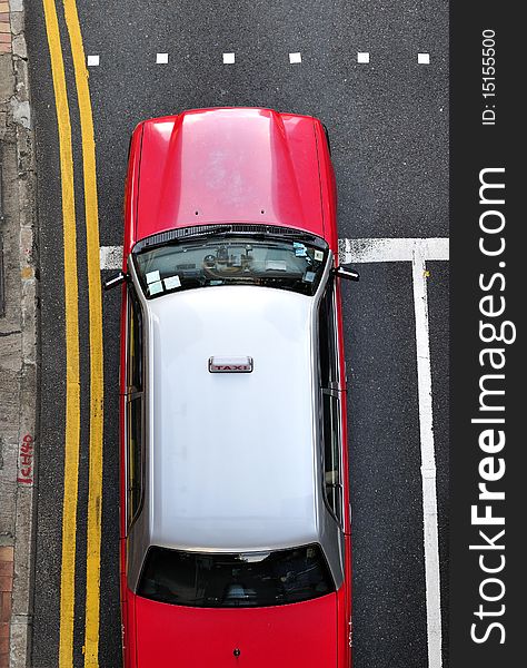 Red Hong Kong taxi, shot from above. Red Hong Kong taxi, shot from above.