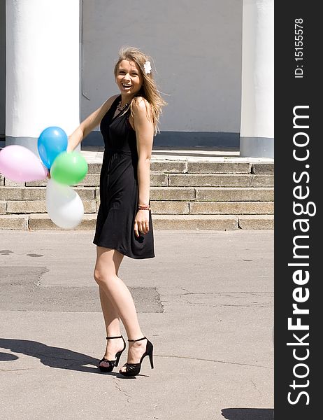 Joyful girl with balloons outdoor