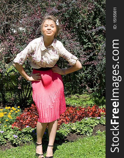 Girl standing near flowers