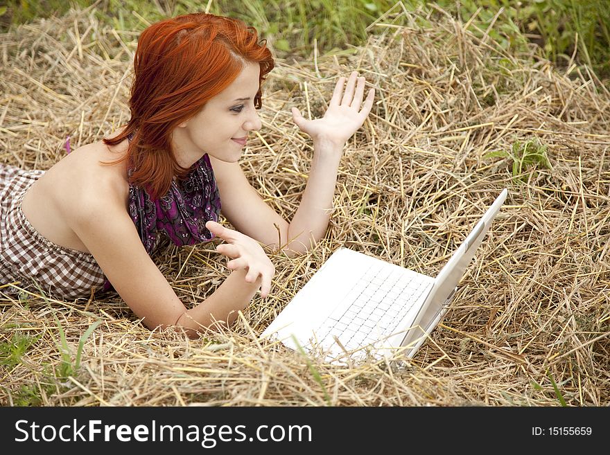 Young  Fashion Girl With Notebook Lying At Field