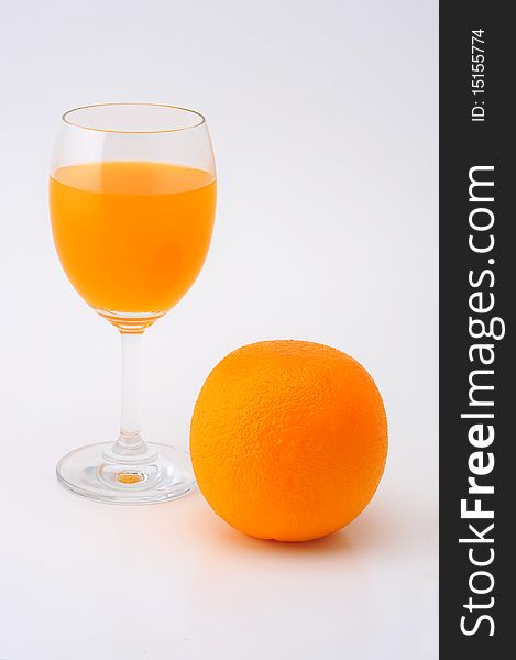 Isolated orange juice with riped orange. Isolated orange juice with riped orange