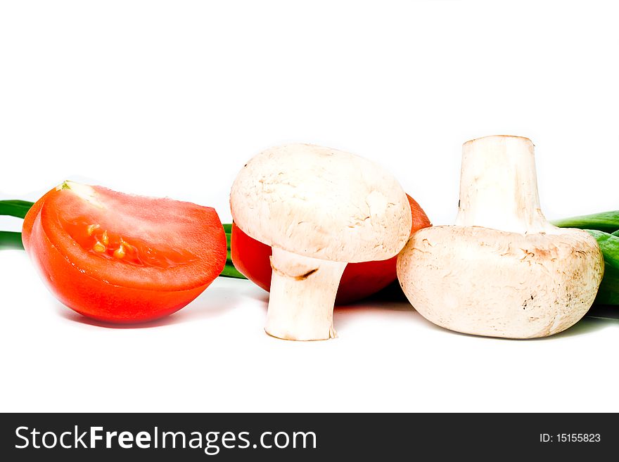 Bow, tomatoes and mushrooms on a white background