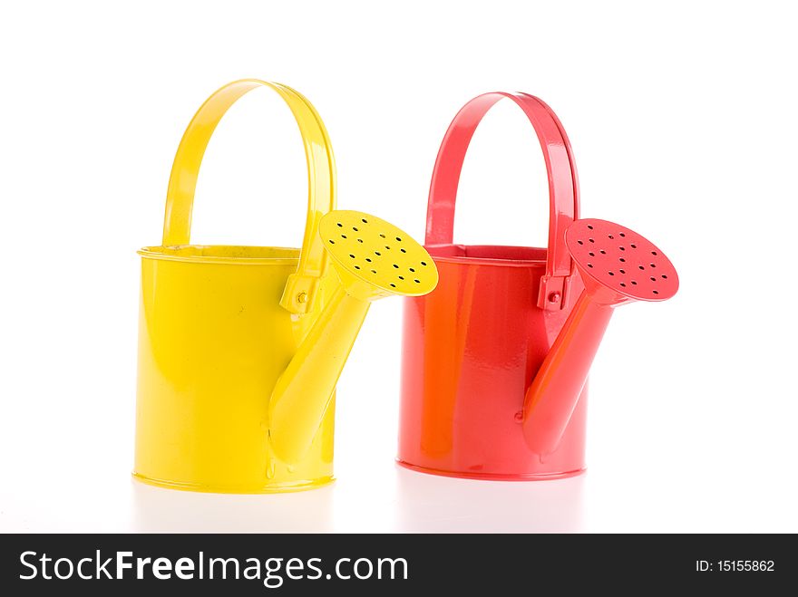 Two watering cans. Studio shot on a white background.