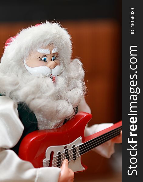 Santa Claus toy playing guitar