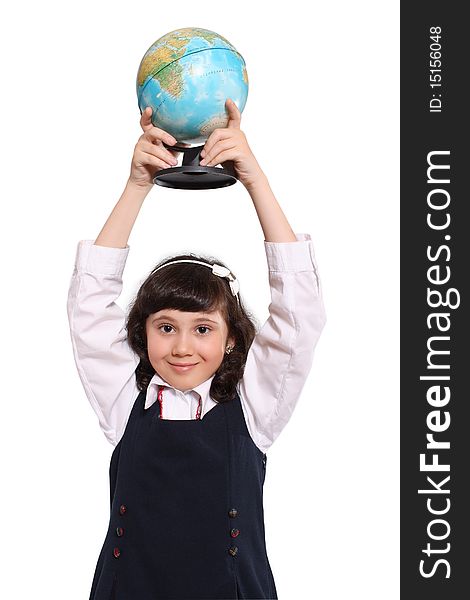 The small schoolgirl holds the globe the hands lifted above a head. The small schoolgirl holds the globe the hands lifted above a head