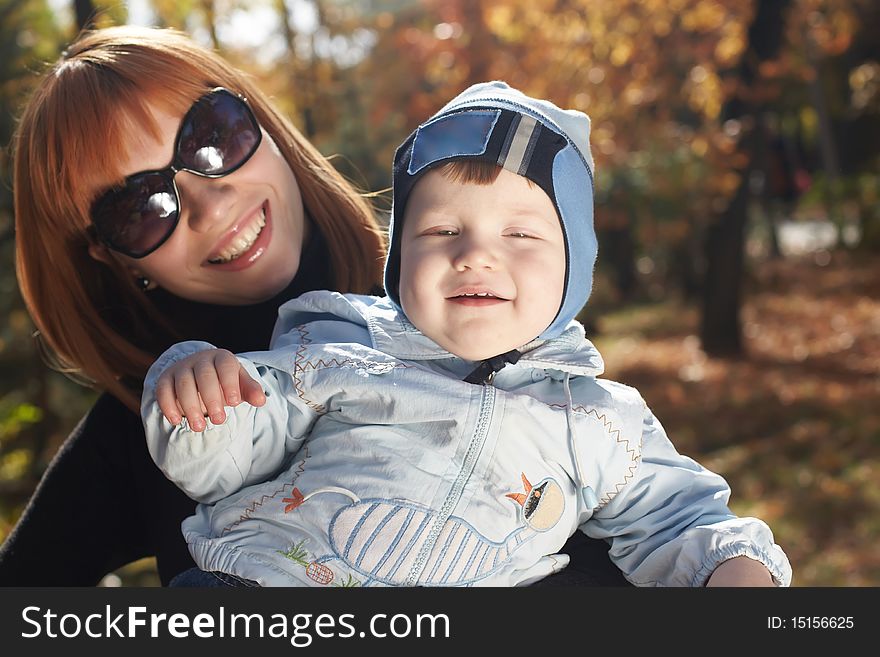 Baby boy with mother play in park. Baby boy with mother play in park