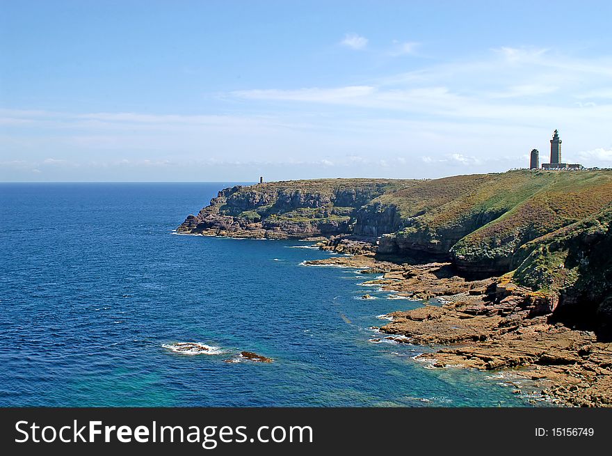 Panoramic view of the cliffs of Cap Frehel with lighthouse in the background