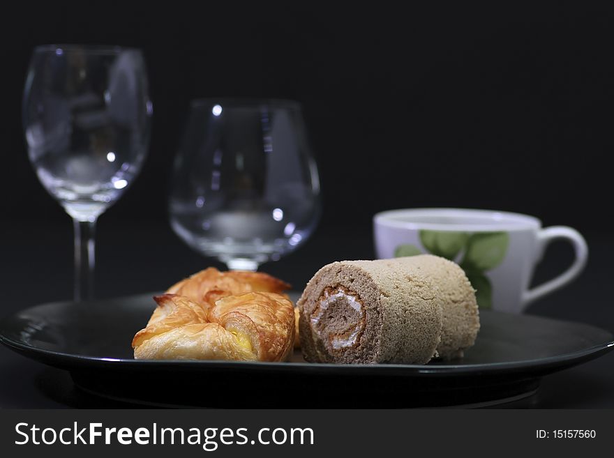 Cake and pie on a black background. Cake and pie on a black background.