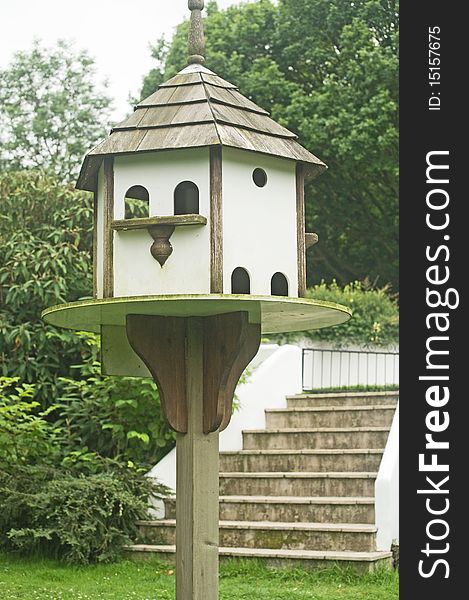 An image of a dove cote supported on a substantial pole in the garden. An image of a dove cote supported on a substantial pole in the garden.