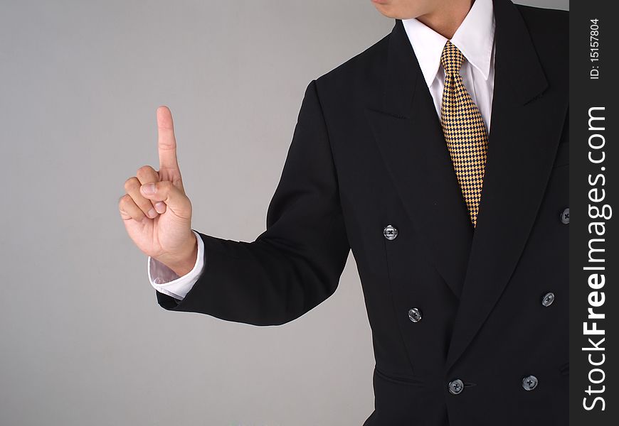 Businessman gesturing to be number one. Businessman gesturing to be number one