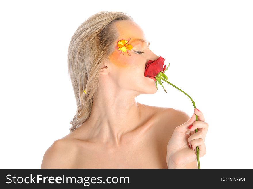 Young woman bites flower isolated in white