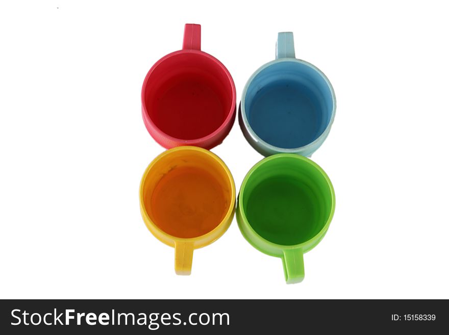 Multi-coloured tea cups,isolated on white