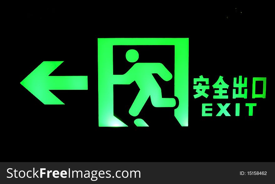 Emergency exit sign shine bright green light