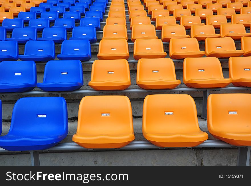 Blue and orange seat in football sadium