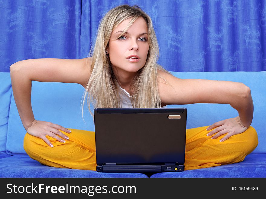 Woman working with PC at home in sofa