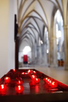 Close-up Photo Of Church Candles In Red Transparent Chandeliers Stock Photos
