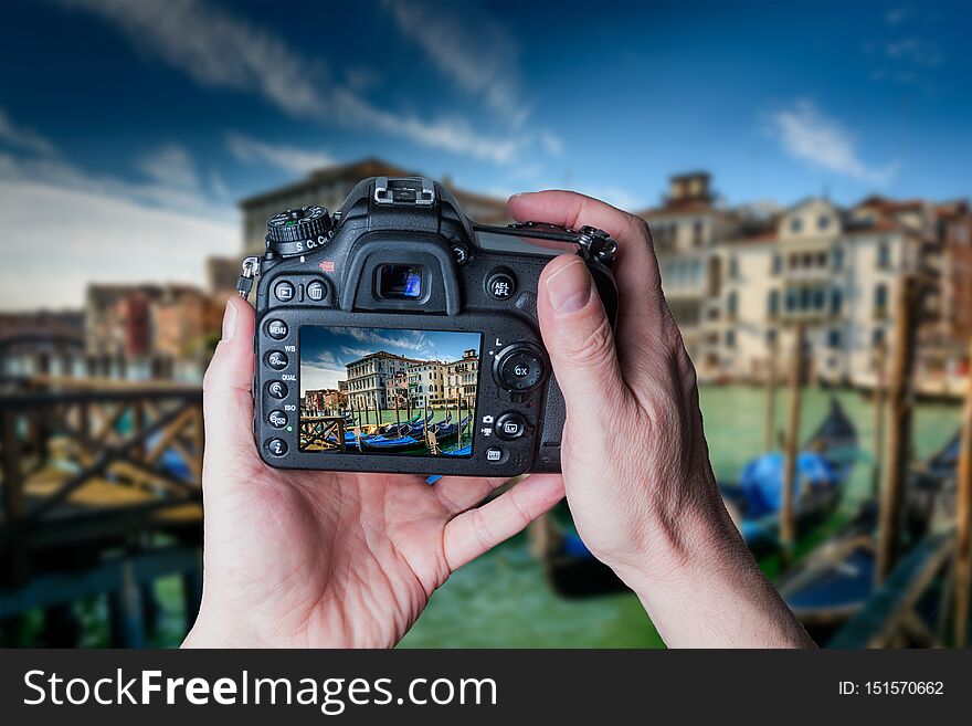 Man taking photo of Gondolas in Venice