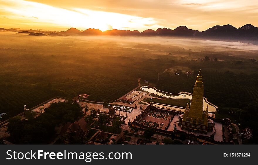 Aerial photo  of Beautiful temples in the morning atmosphere , Thailand .