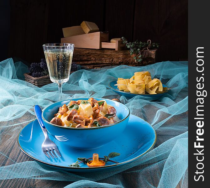 A pappardelle with cheese sauce and fresh chanterelles