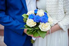 Wedding Bouquet In The Hands Of The Bride And Groom Stock Image