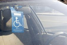 Handicap Sign On A Rear View Mirror Royalty Free Stock Photo