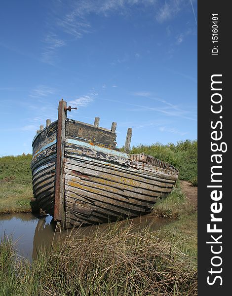 Abandoned boat against blue sky. Abandoned boat against blue sky
