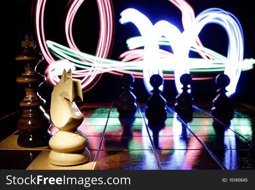 White horse on the chess board with color light background. White horse on the chess board with color light background