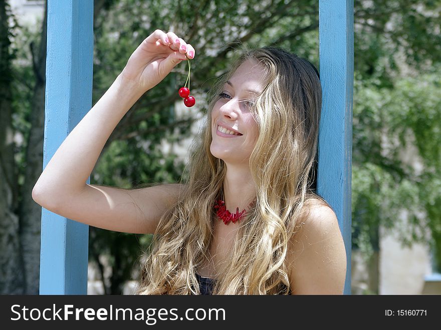 Smiling Lady On Swing With Cherry