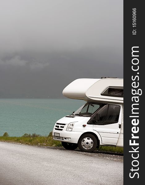 picture of a motorhome in norwegian mountains on a  fjord. picture of a motorhome in norwegian mountains on a  fjord