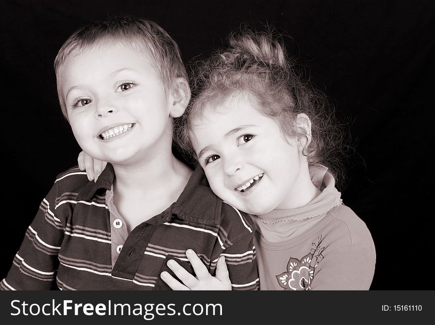 Beautiful young girl with curly hair and her cute boy friend. Beautiful young girl with curly hair and her cute boy friend