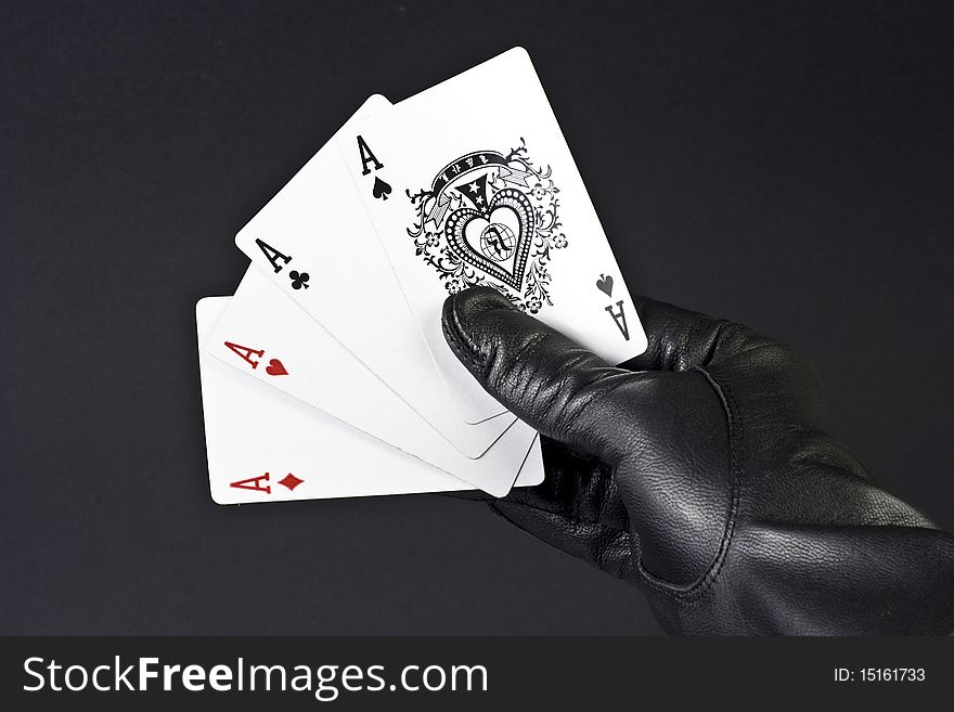 Four cards in black hand