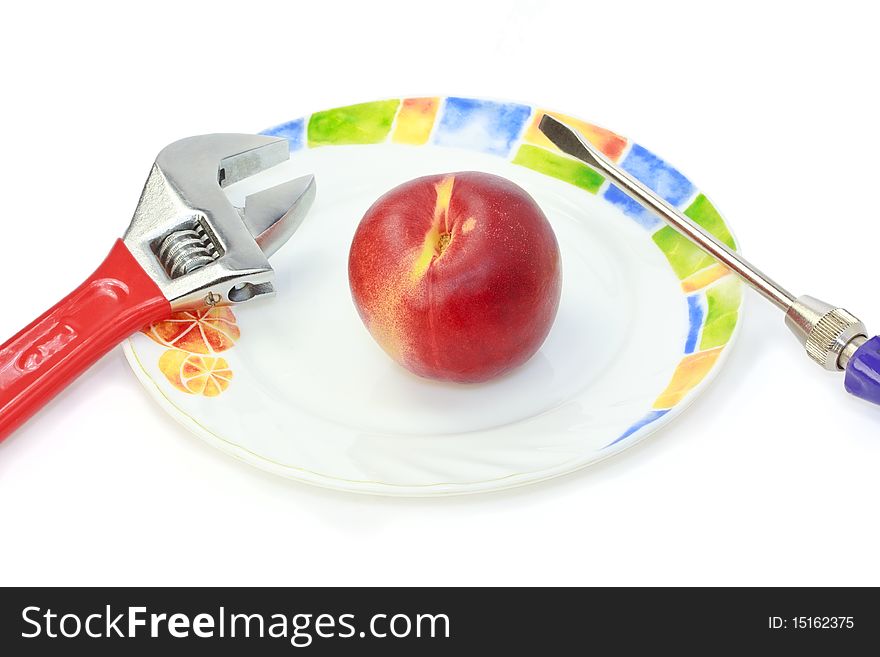 Futuristic scene of juicy nectarine for the cyborg`s diet nutrition. It`s hard enough to eat with screw-driver and wrench. Futuristic scene of juicy nectarine for the cyborg`s diet nutrition. It`s hard enough to eat with screw-driver and wrench.