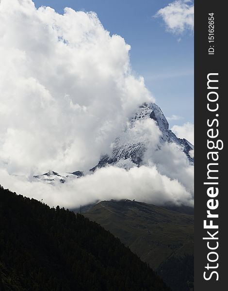 The symbol of the Alps - the Matterhorn in the clouds.