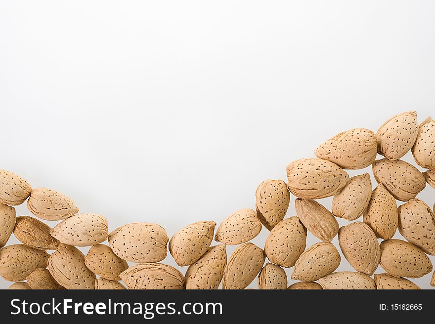 Almonds on white background wiht copy space. Almonds on white background wiht copy space.